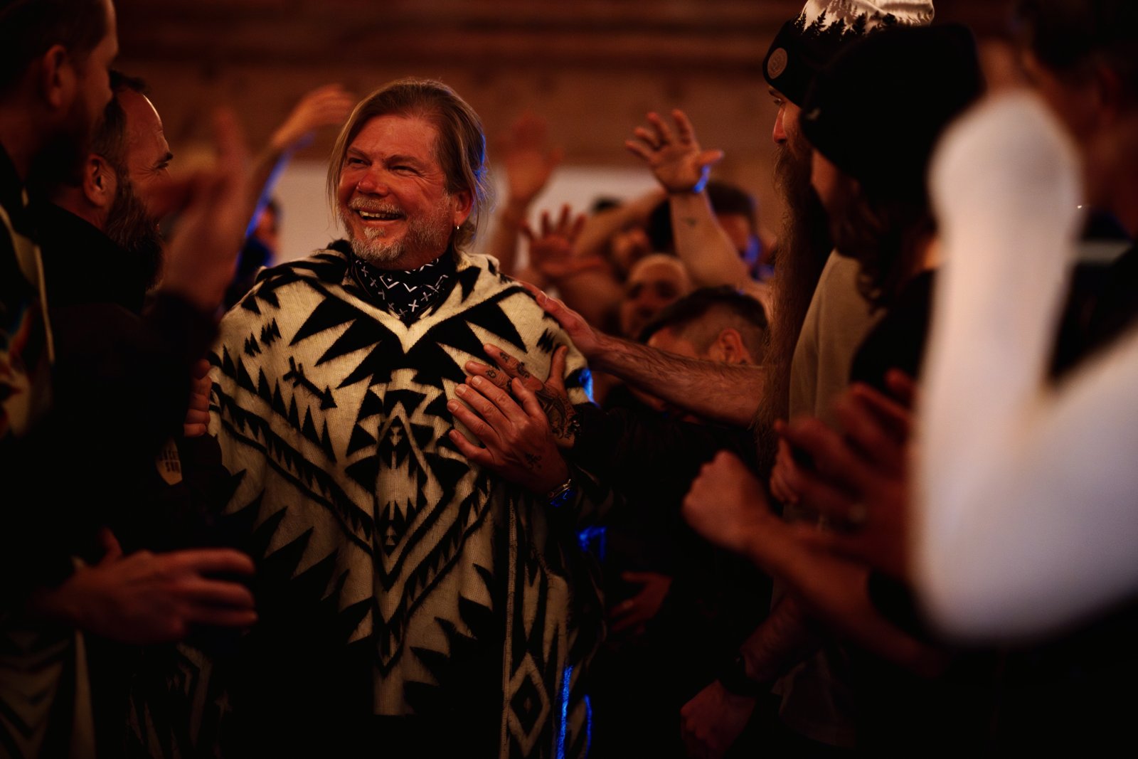 Vince Chafin in a circle of men after an initiation